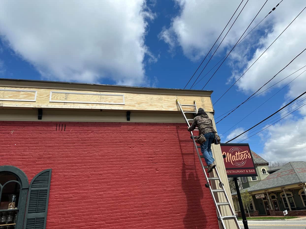 A Southwest Companies employee performing preventative commercial painting for a business in Olmsted Falls, Ohio.