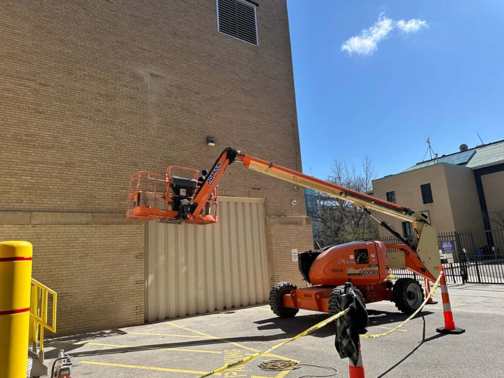 Southwest Companies completing brick replacement and tuckpointing for a commercial building.