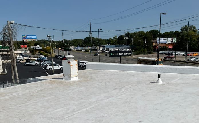 A completed flat roofing job for a commercial building to help seal the building envelope.